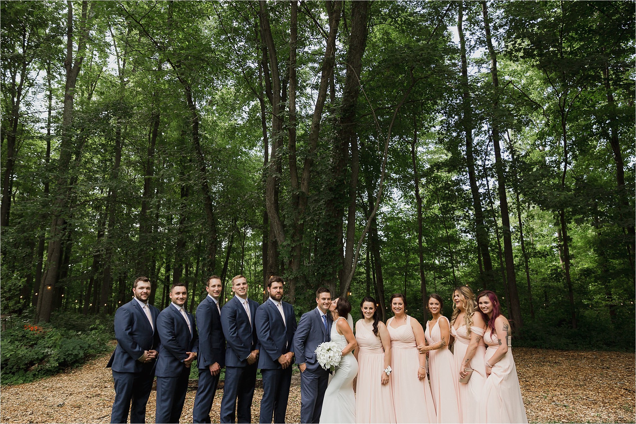 Sonia V Photography, The Clearing ceremony wedding venue, bridal party posing for a photo in the forest