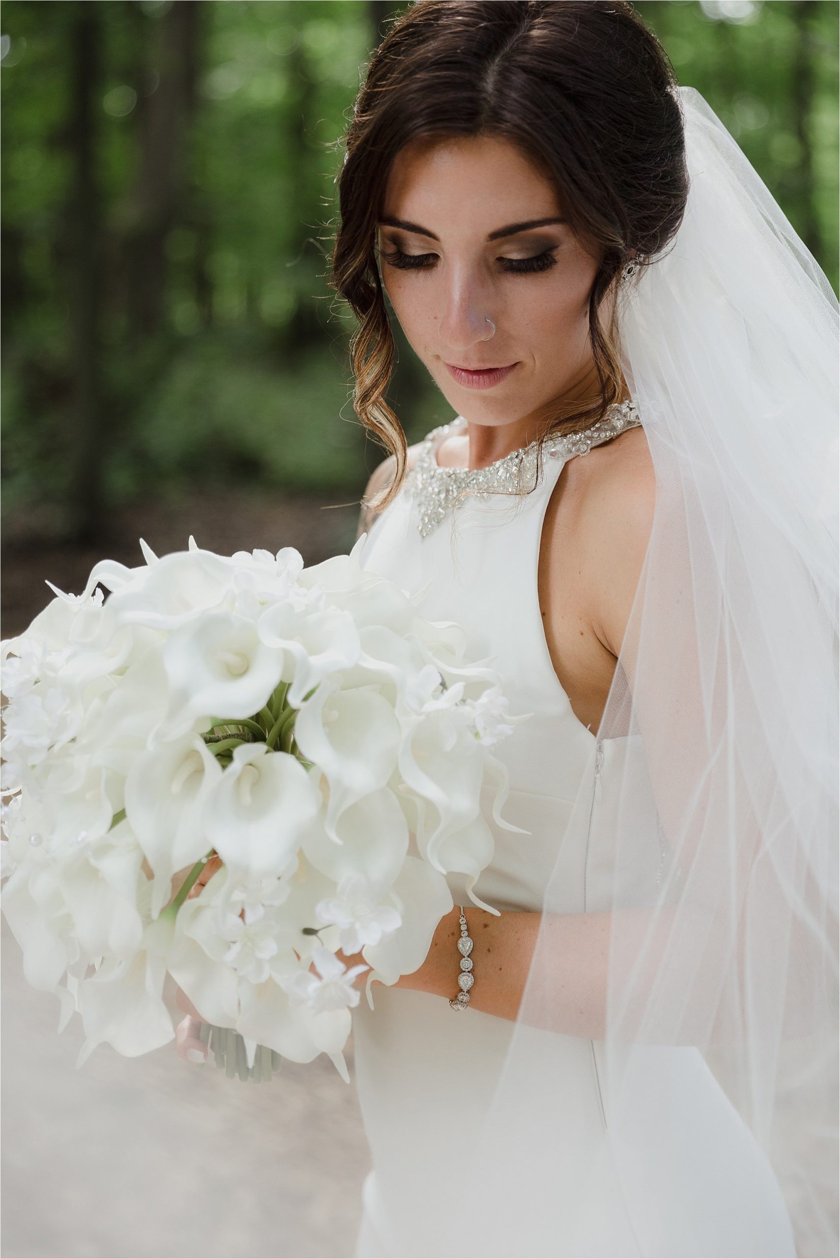 Sonia V Photography, The Clearing ceremony wedding venue, bride in the forest with floral bouquet and veil