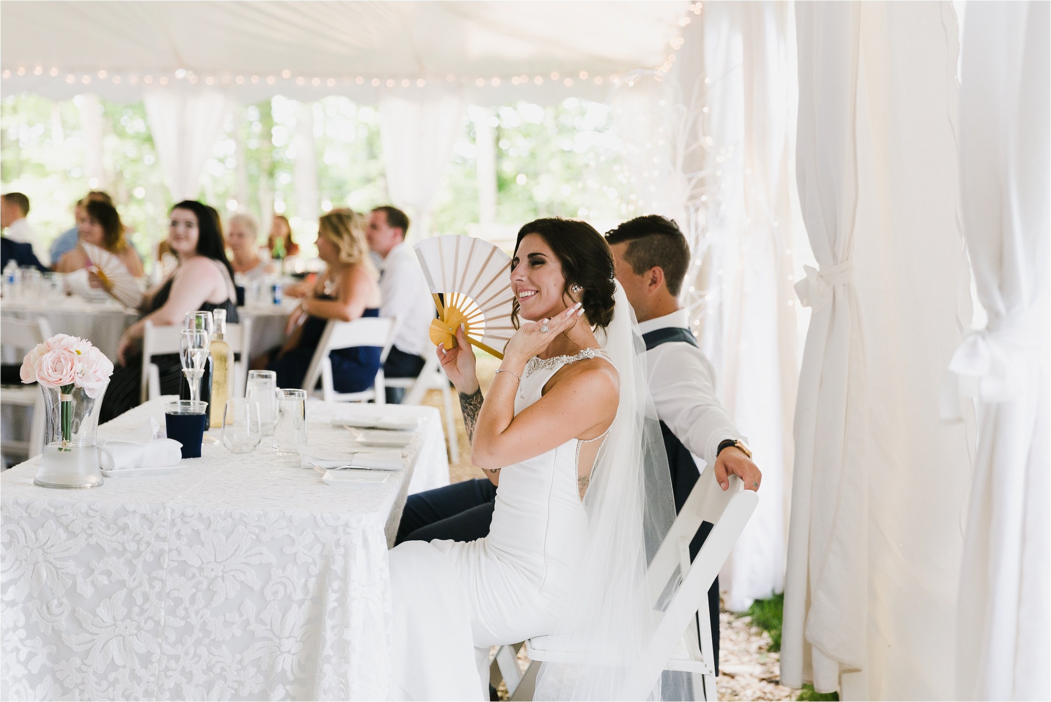 Sonia V Photography, The Clearing reception wedding venue, outdoor tent dinner, bride and groom seated at table