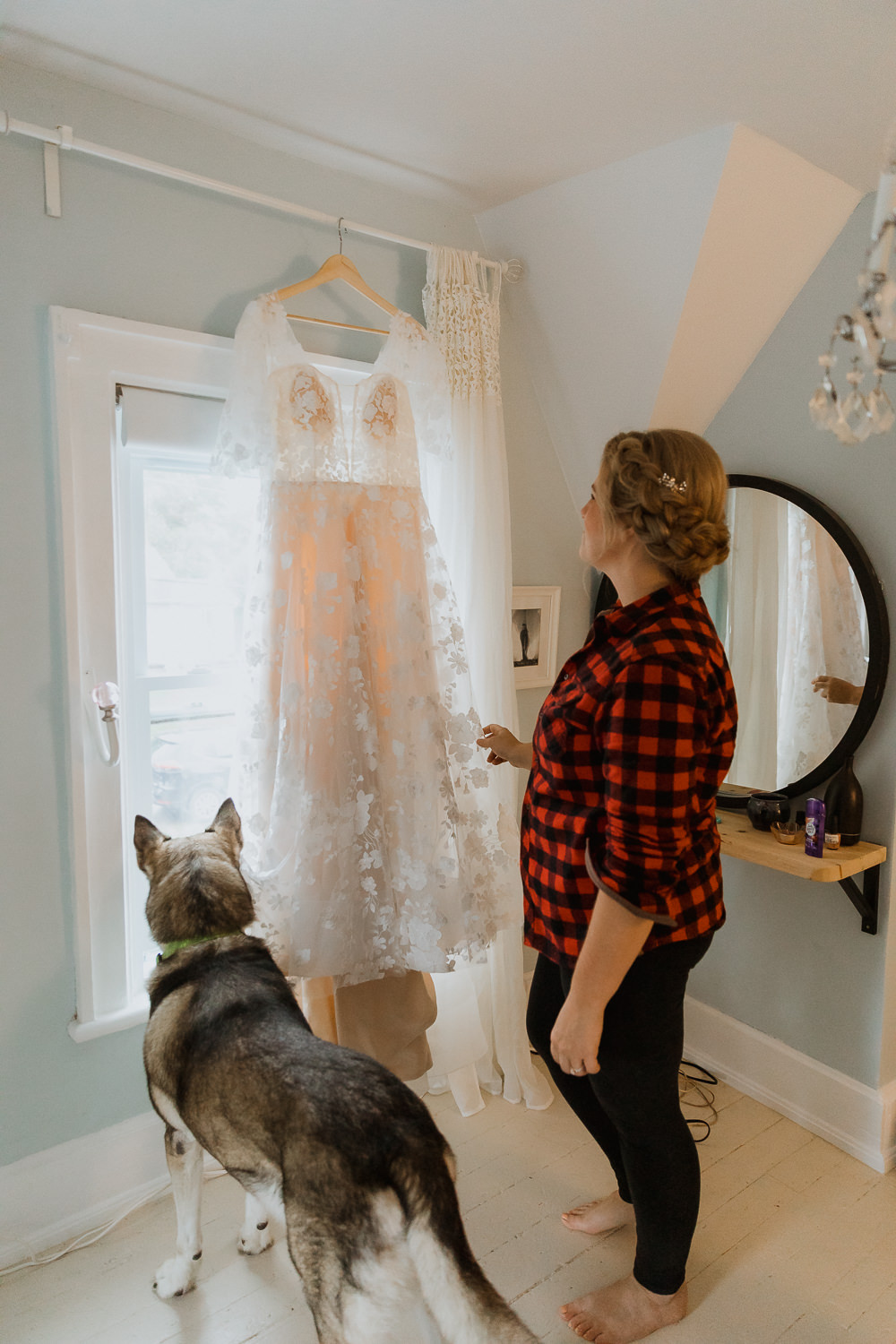 Bride getting ready with dog looking out window Rainy-fall-wedding-at-The-Knox-Merickville-by- Sonia V Photo - Documentary Style Candid Photographer - Ottawa Ontario Kemptville Destination Photographer - Authentic Colour Photography - Wedding Photographer - Branding Photographer - Small Business Headshots - Engagement Photos - Family Portraits - Lifestyle