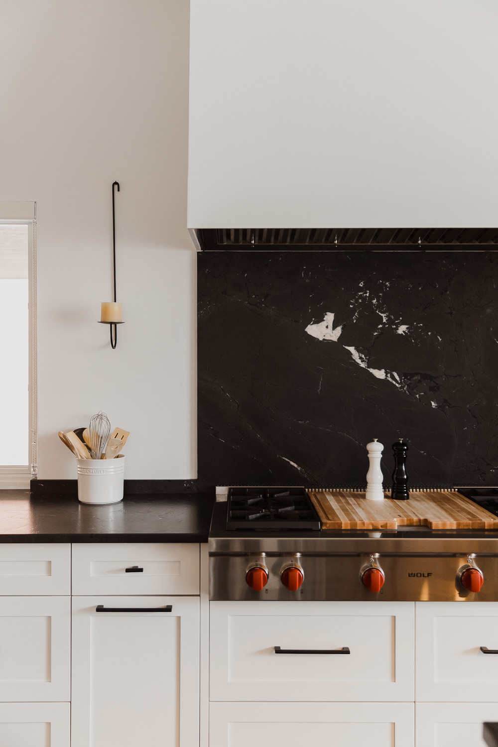 Black stone backsplash Kitchen with large island lamp and rattan stoolsIndian inspired home in the Glebe Ottawa Ontario Studio-Kahaani-Ottawa-interior-design-inspiration-ideas-brand-photos-by-Sonia-V-Photography