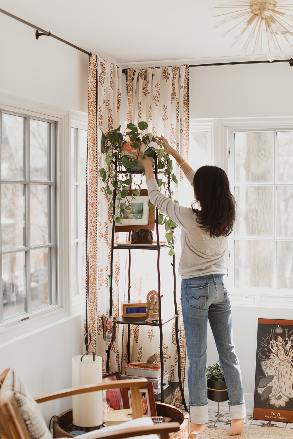 woman decorating in Home office design curtains black french doors white desk Indian inspired home in the Glebe Ottawa Ontario Studio-Kahaani-Ottawa-interior-design-inspiration-ideas-brand-photos-by-Sonia-V-Photography
