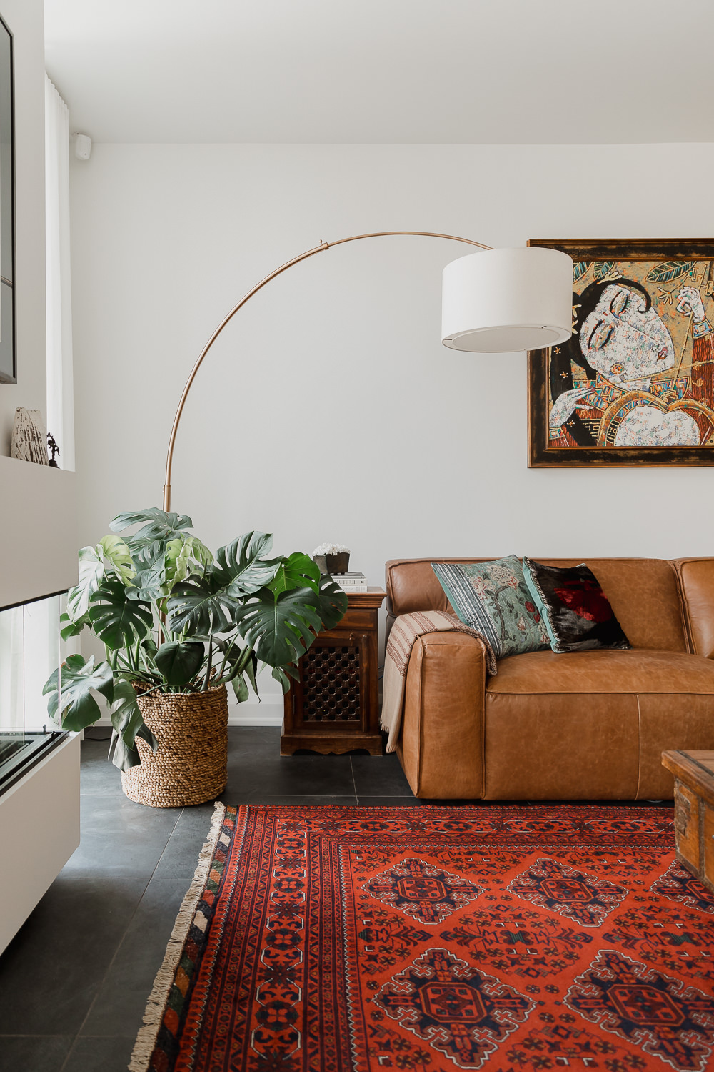 Living room with arch lamp leather couch persian rug Indian inspired home in the Glebe Ottawa Ontario Studio-Kahaani-Ottawa-interior-design-inspiration-ideas-brand-photos-by-Sonia-V-Photography