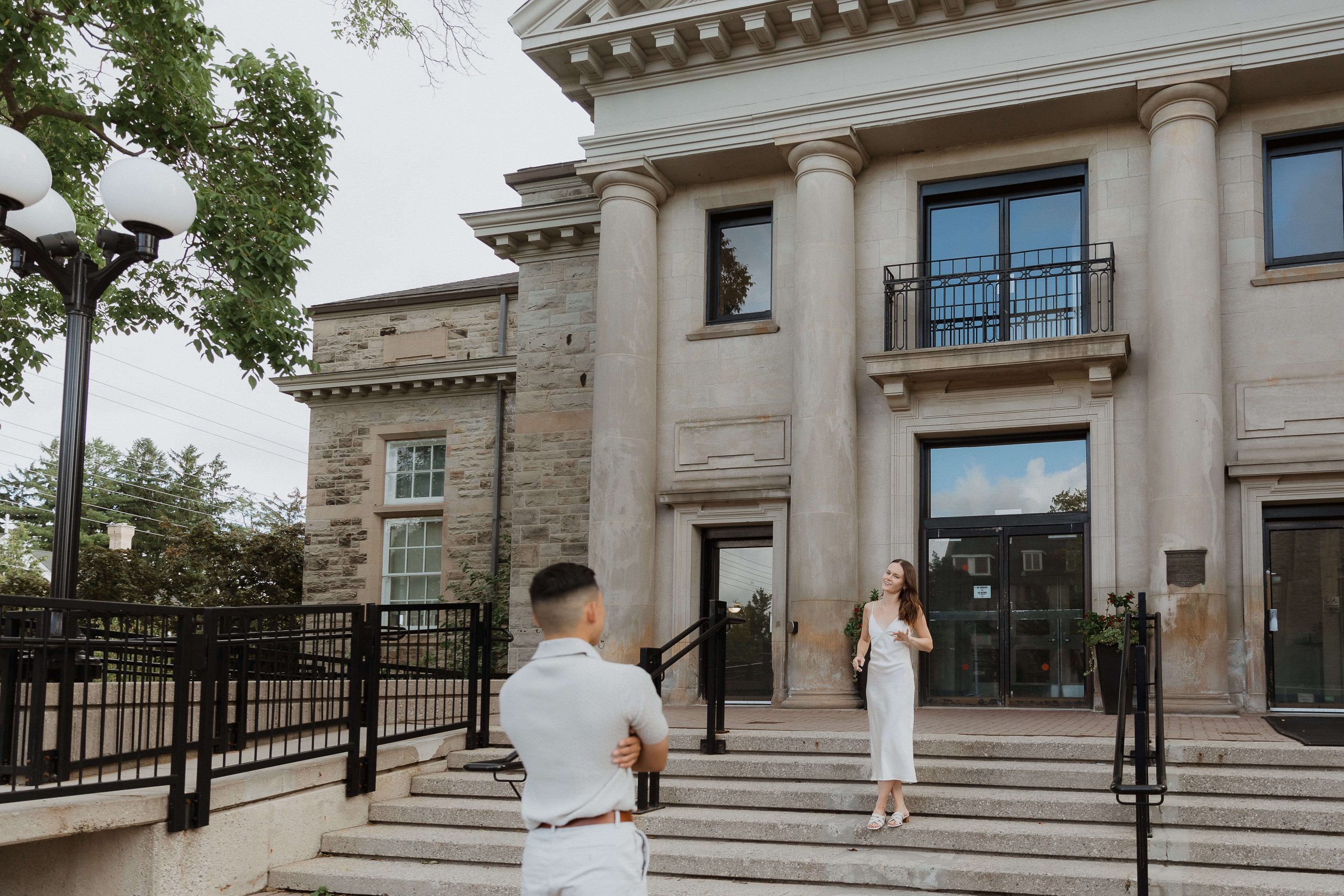Engagement photos at Guelph University outside the old buildings | Sonia V Photography standing on stairs