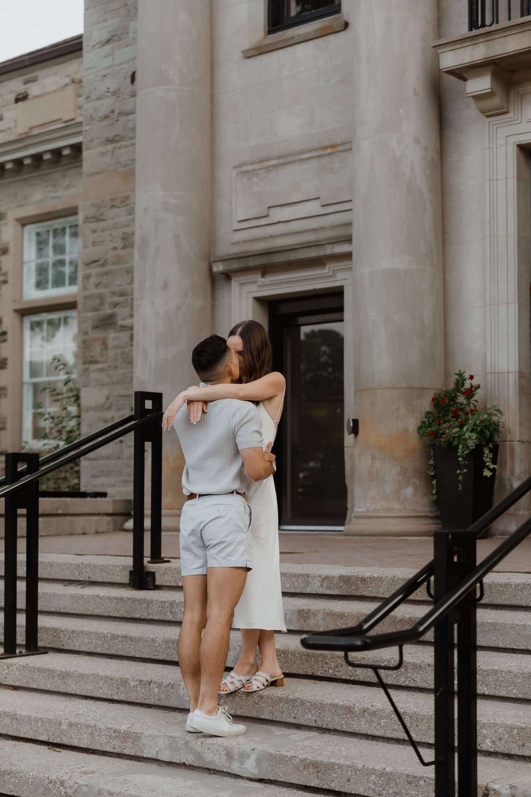 Engagement photos at Guelph University outside the old buildings | Sonia V Photography standing on stairs