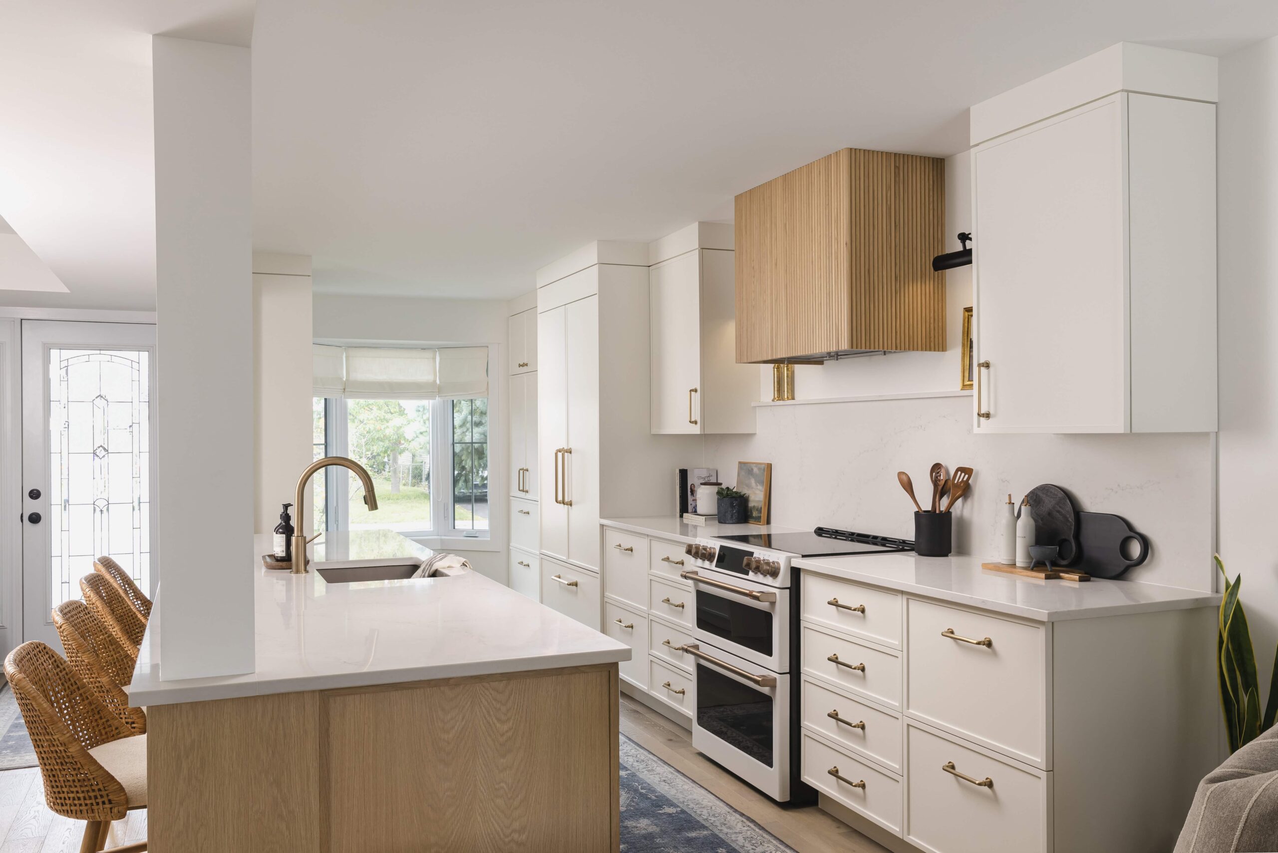 Warm Open-Concept Kitchen & Bath with Brass Accents - Sonia V Photography
