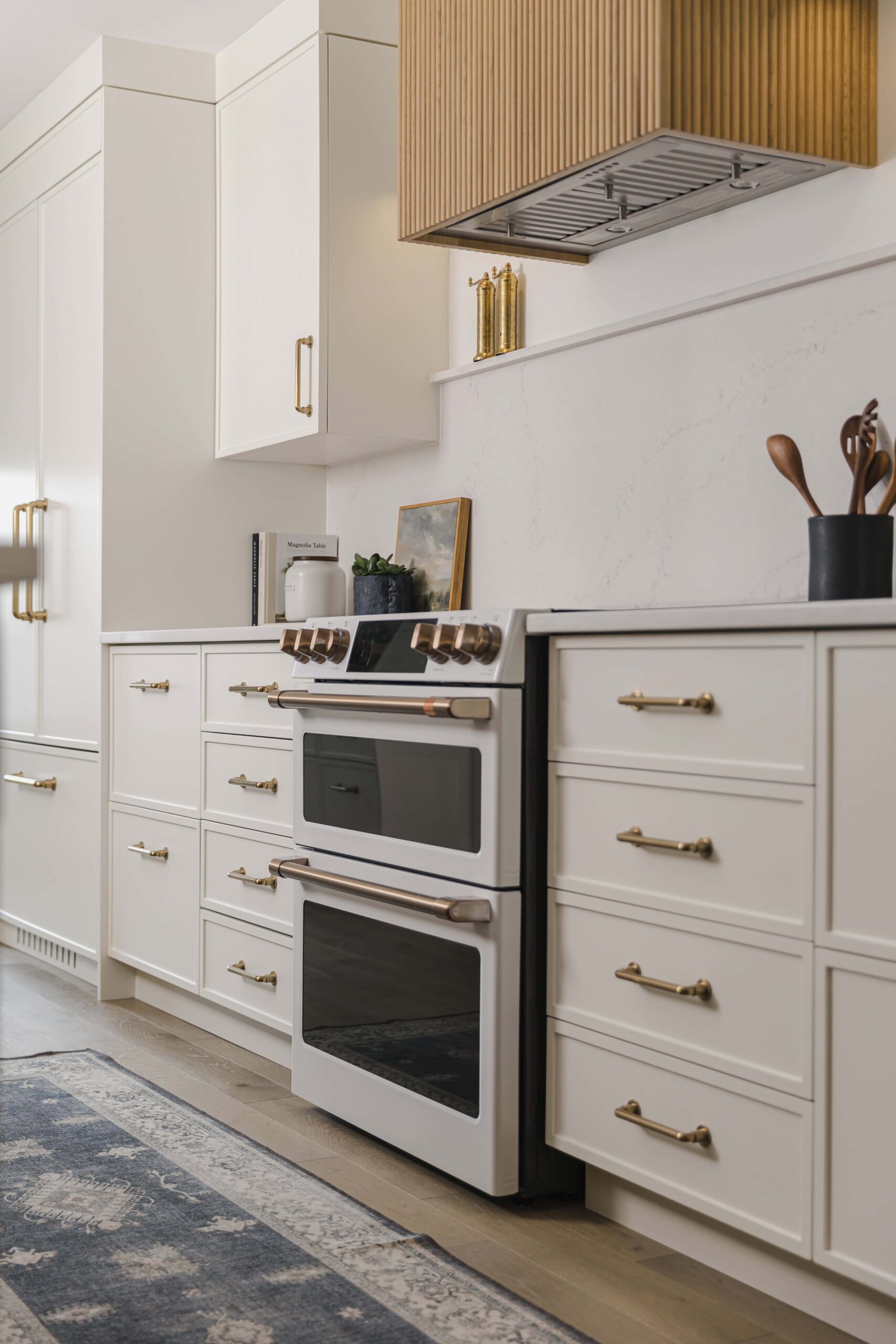 Warm Open-Concept Kitchen & Bath with Brass Accents - Sonia V Photography