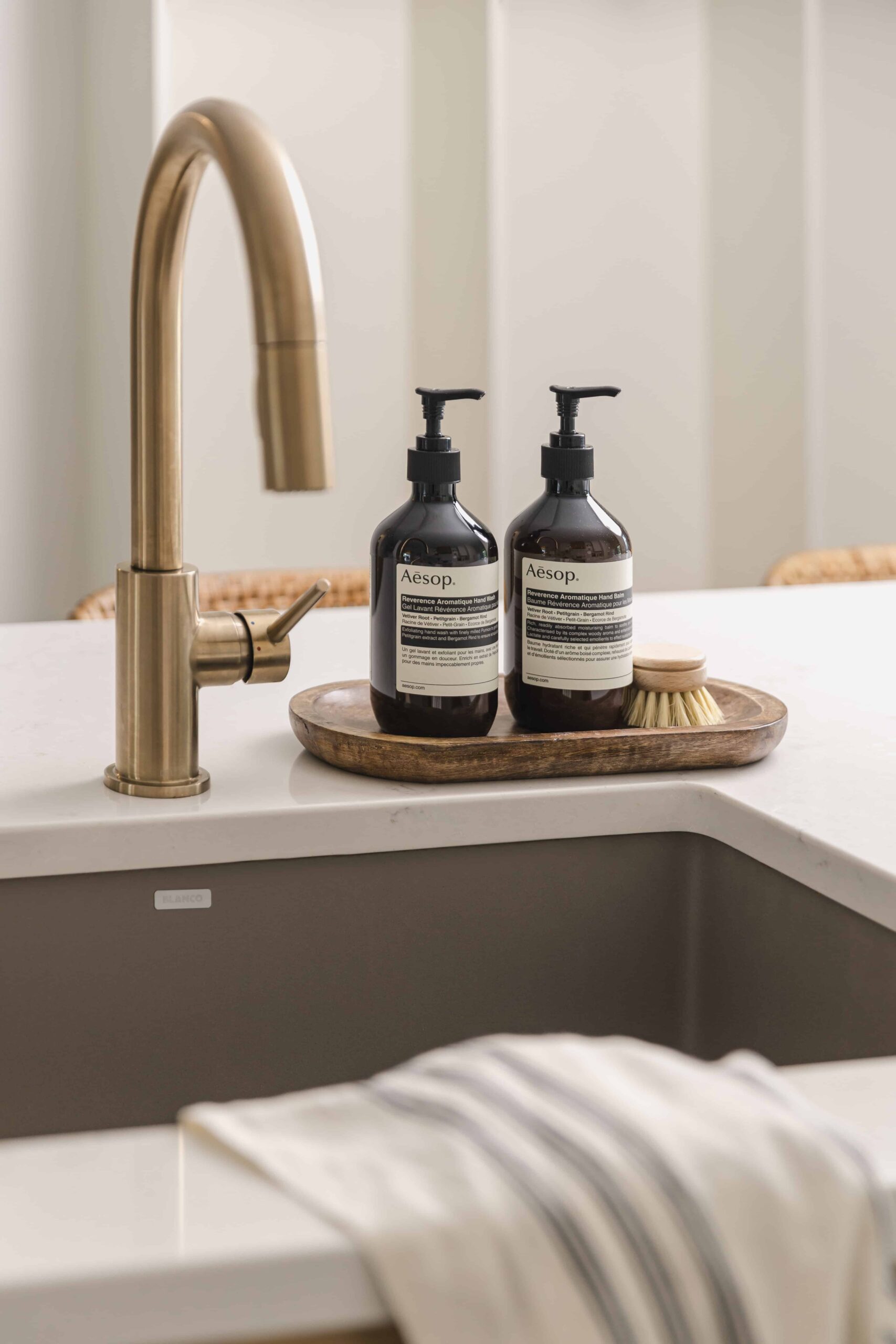 Warm Open-Concept Kitchen & Bath with Brass Accents - Sonia V Photography