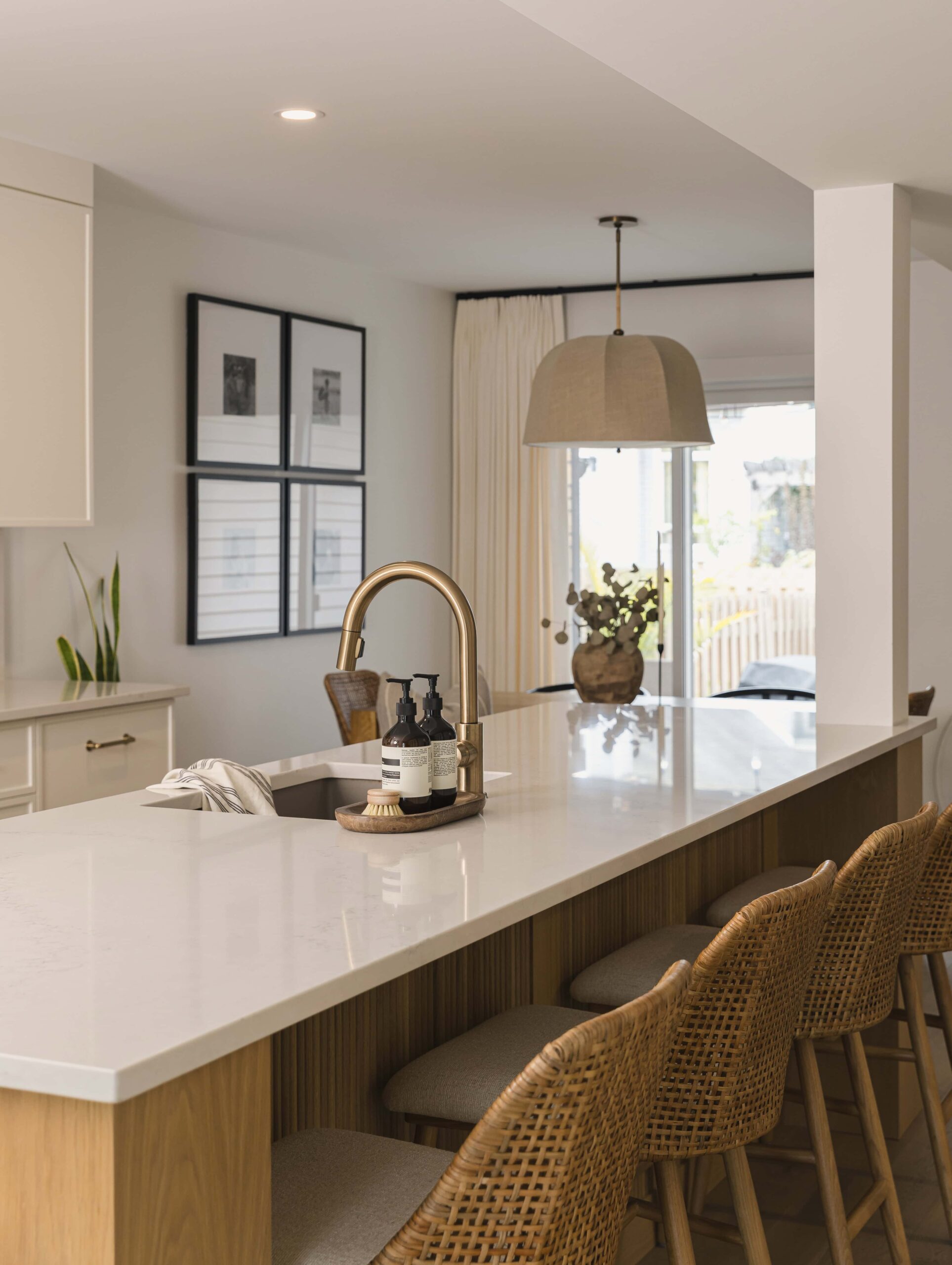Warm Open-Concept Kitchen & Bath with Brass Accents - Sonia V Photography