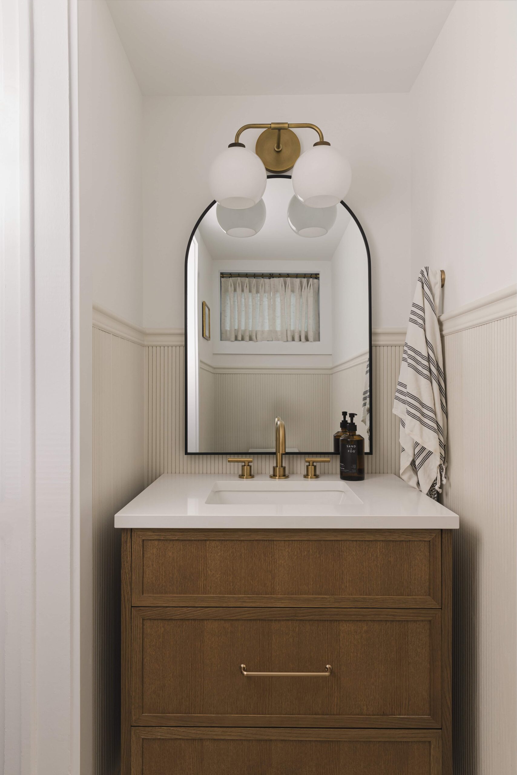 Warm Open-Concept Kitchen & Bath with Brass Accents - Sonia V Photography