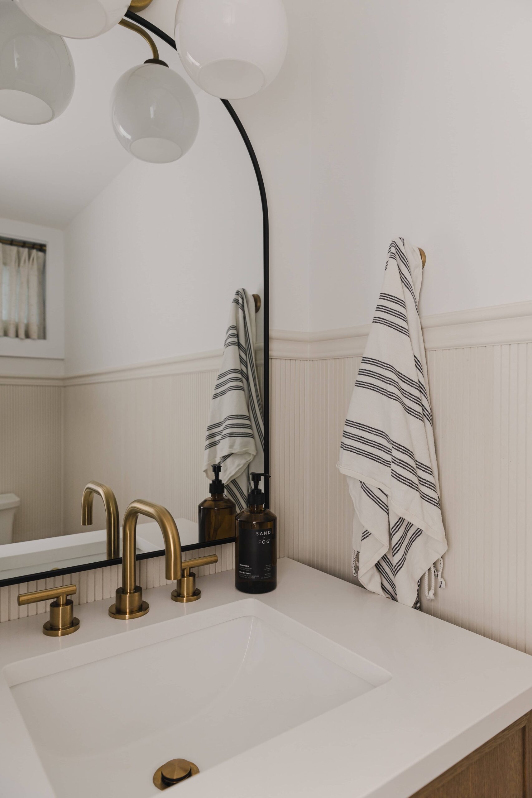 Warm Open-Concept Kitchen & Bath with Brass Accents - Sonia V Photography