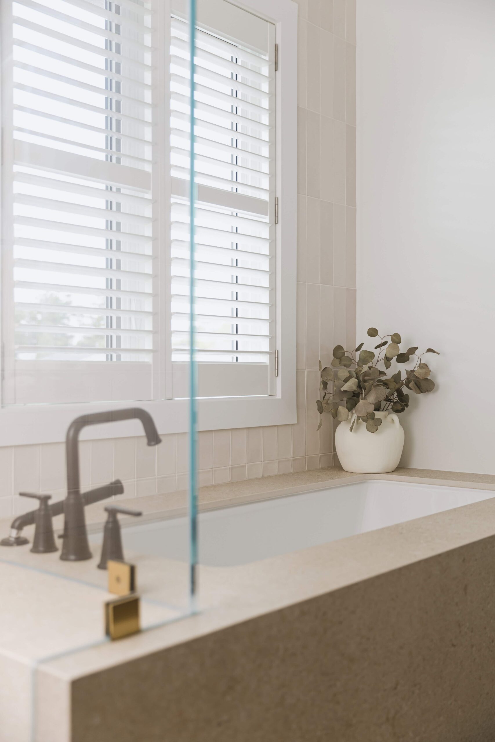Warm Open-Concept Kitchen & Bath with Brass Accents - Sonia V Photography